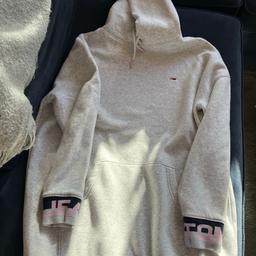 Tommy Jeans 
Tommy Hilfiger Sweatshirt Dress.  Grey.  Hooded.    Front pouch pocket.  Tommy Jeans Logo around bottom and sleeve cuffs.  Thick material and super warm, has a bit of bobbling.