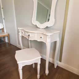 Wooden painted white solid and heavy just some water marks on the stool mirror can be hung or freestanding