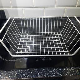 under counter shelving wire basket.

allows for extra storage in cupboards.