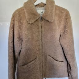 Very nice Hollister bear jacket in beige, size L. Used but in very good condition.