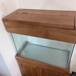 Oak wood fish tank 100 litres ,in excellent condition selling it with all accessories (back glass wall paper ,stones ,artificial plants ,ship decoration,clean water kit supply ,filter and heater)