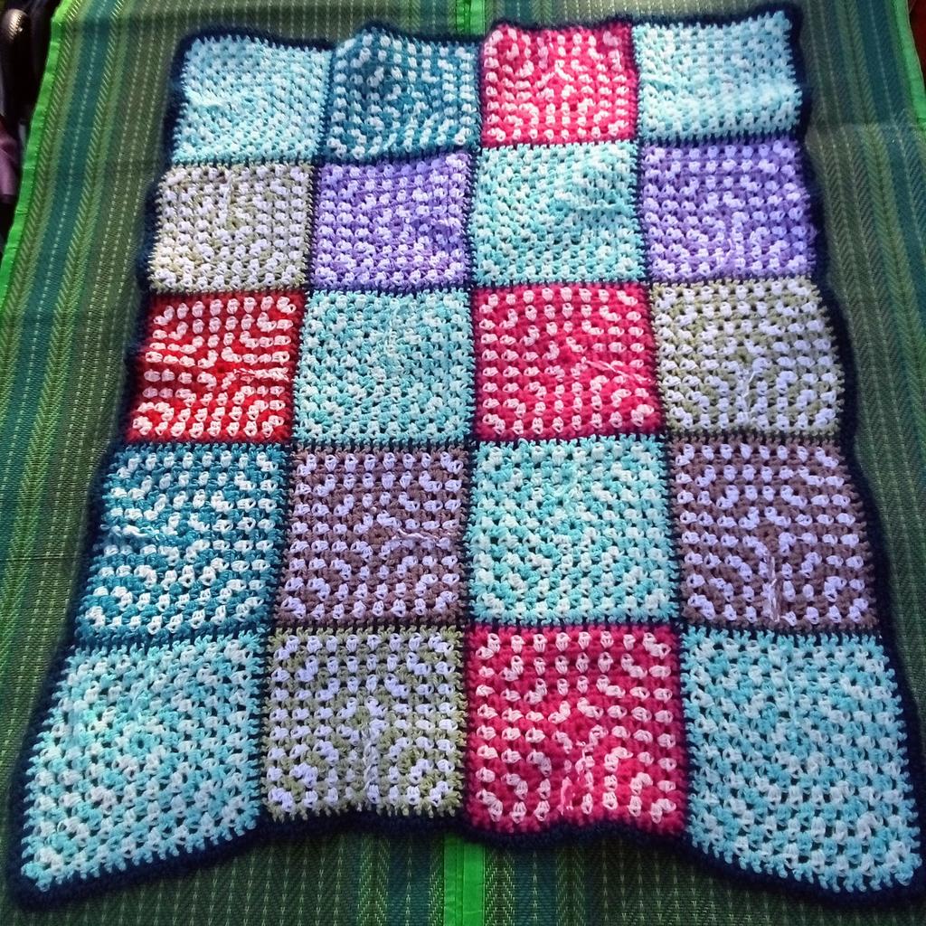 Lovely hand knitted throw would be great in a campervan, cot, lap, sofa throw or even decorative wall ornament etc

L100XW80cm.

Made by a neighbour so helping out to sell. Made of thick woolen yarn as can be seen in the photographs.

A variety of great colours, so brighten up these cold evenings.