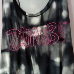 Zumba Racer / Fitness loose Tank Top - Medium.

Steal the spotlight in the Zumba Party Loose Tank! With a colorful print on the front; this tank is perfect to move and groove in.

PRODUCT FEATURES
- Colorful Print on Front.
- Antimicrobial for Odor Control.
- Relaxed Fit.

Please note:  This top runs BIG AND LOOSE.

WHY YOU'LL LOVE IT
- 100% Polyester

Bought but not used due to pregnancy, so someone else can make use now.

Could be posted out for extra costs, but local collection preferred.