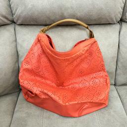 Big orange Avon handbag. Used in good condition. Zip is working. Little marks of use. Collection in Sale and cash only please.