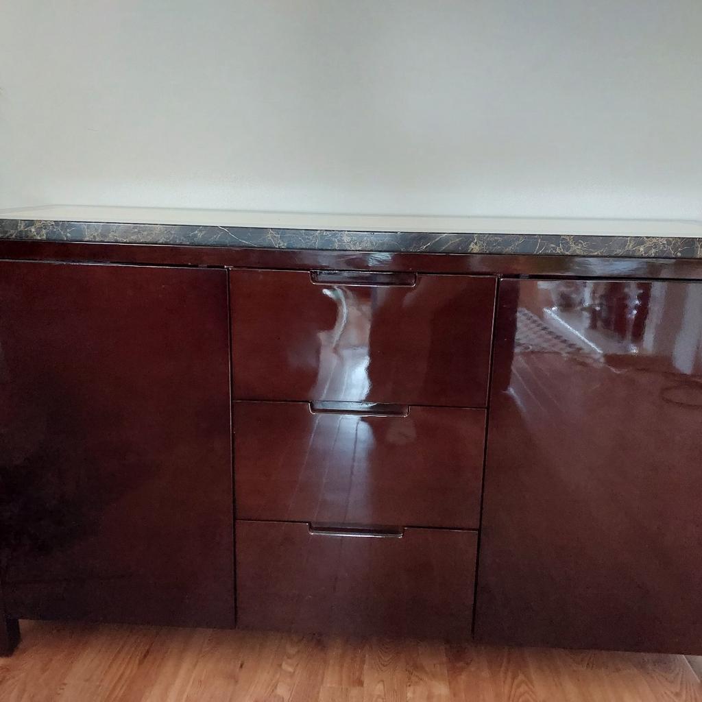 Marble top dark brown Side Unit. In good condition. Collect from Sutton
80cm Height
45cm Depth
140cm width