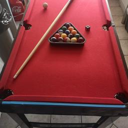 a 4 in 1 games table 
pics to see details 
snooker/pool with triangle, full set of balls, chalk 1 cue which needs tip.
fuse ball all ok
table tennis which comes with net 2 bats and 2 balls.
air hockey with disc and 2 player handles.
There are a few flaws which I'll list 
pool table - only 1 pool cure which needs a tip.
air hockey side has water damage as you can see in photo,but does not affect use.
price is lowered due to the air hockey part being damaged and cue tip missing and 1 cue only.

collection only and it is still assembled
