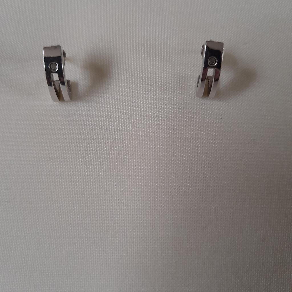 Silver huggie earrings with single diamante detailing. Never really y worn. Pet and smoke-free home. Collection only.