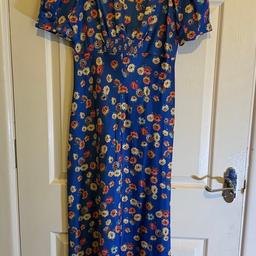 Blue Floral Satin ASOS Dress with tag.  Size 10

Brand new, blue floral ASOS dress. With slit down the back.  This dress has never been worn and still has the tag on. 

Size 10 - will fit size 8/10 
RRP £29.99