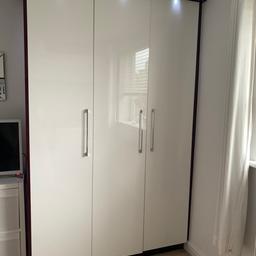 Gloss white fitted wardrobe with purple trim
Double and single
Both With hanging rail and 2 drawers at the bottom

And over the bed storage (3 double cupboards)