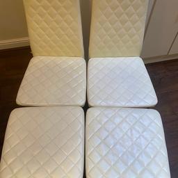 4 cream faux leather high back dinning chairs two seats with some marks on but otherwise in good condition