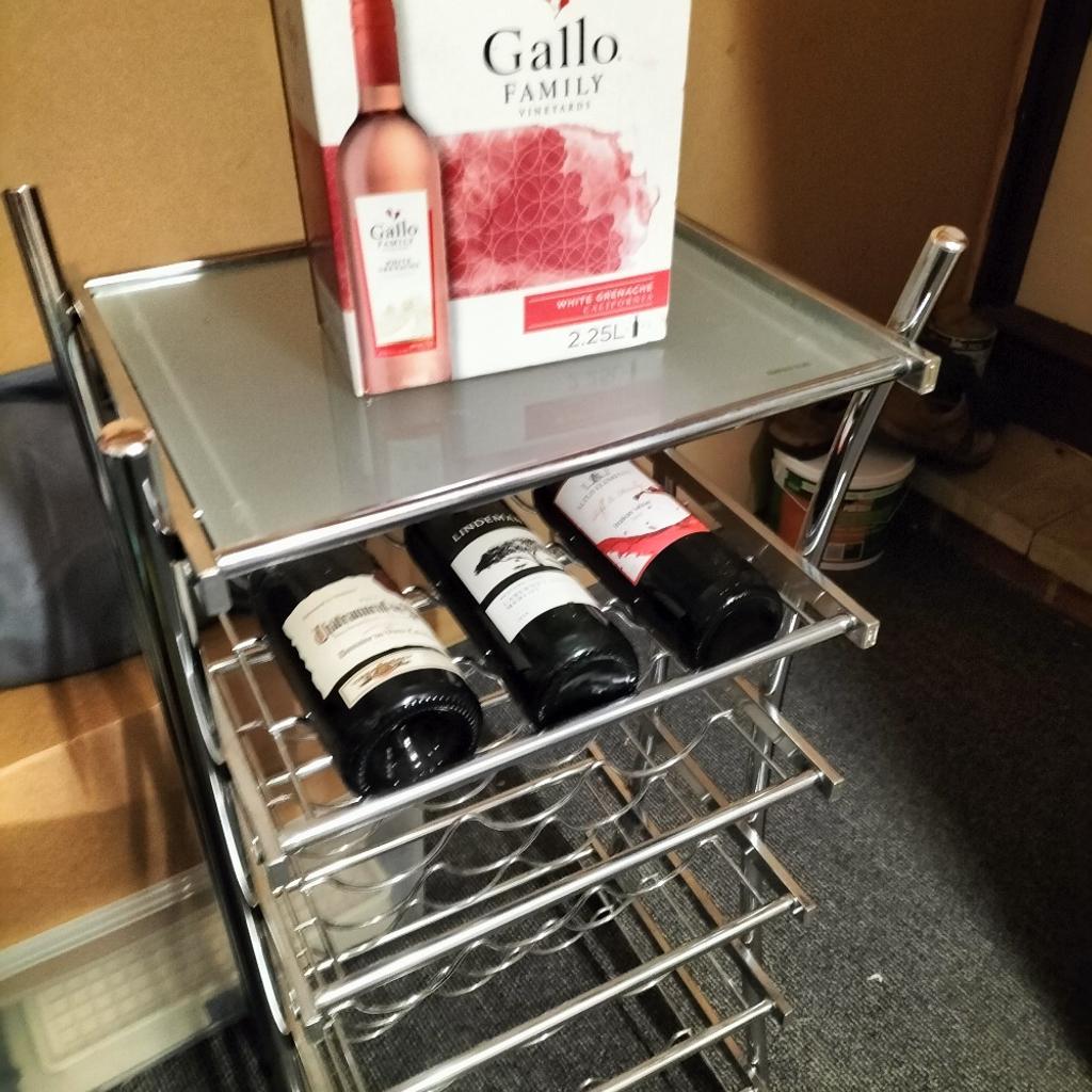 Chrome wine rack holds 15 bottles with glass shelf on top good condition 20pounds £16pounds