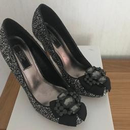 Reduced by £3.00 to £15.00.

Ladies Occasion Shoes Size 4 (Dorothy Perkins) in immaculate like new condition.
Black / Silver glitter with embellished front. Worn only once.
Can be collected from Farsley, Leeds LS28 or posted at the buyers expense.
