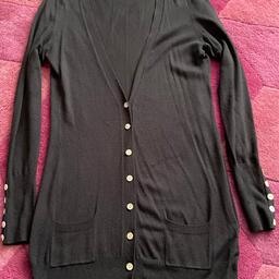 Black long Next cardigan.
Size 8.
Button detail on sleeves.
Pockets on front.
Very good condition.
Cash on collection please.