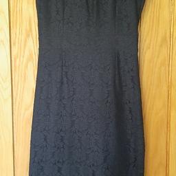 Beautiful navy blue lace dress from Dorothy Perkins. Soft material with a low back. 
Capped sleeves. Knee length.
Size 8.
Very good condition.
From a pet and smoke-free home.