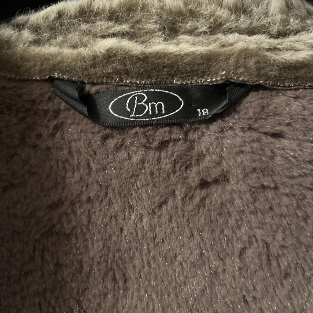 Grey faux suede long jacket with faux fur trim and lining by Bon Marche, ladies size 18.
Hardly worn so still in very good condition.