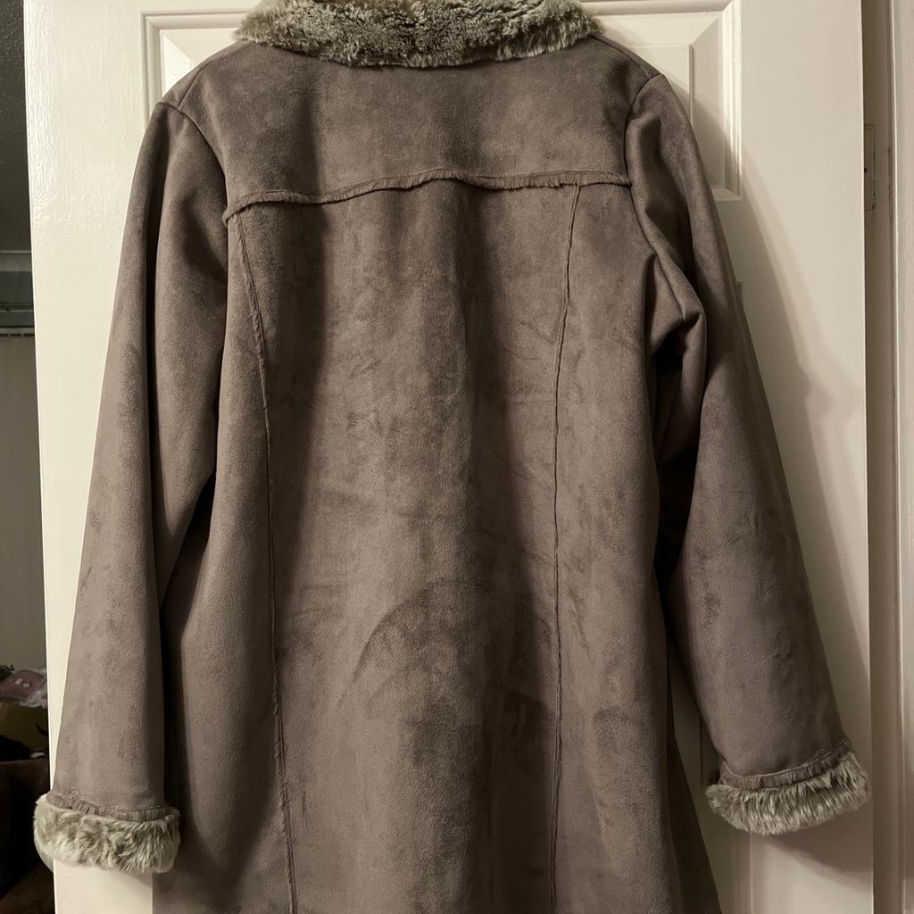 Grey faux suede long jacket with faux fur trim and lining by Bon Marche, ladies size 18.
Hardly worn so still in very good condition.