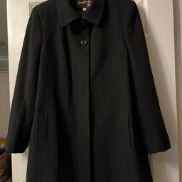 Ladies black, genuine wool and cashmere heavy winter coat, size 18 by David Barry, London, featuring collar and concealed front buttons.
Hardly worn so still in great condition.