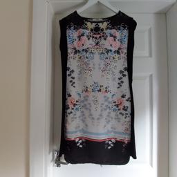 Dress „Oasis“

Without Belt

Black Multi Colour

 Good Condition

Actual size: cm

Length: 84 cm front

Length: 85 cm back

Length: 60 cm from armpit side

Shoulder width: 46 cm with small sleeves

Volume hand: 35 cm

Breast volume: 90 cm – 92 cm

Volume waist: 85 cm – 88 cm

Volume hips: 90 cm – 92 cm

Size: XS

Main: 100 % Polyester

Contrast: 96 % Viscose
 4 % Elastane

Lace: 86 % Cotton
 14 % Polyester

Made in Turkey