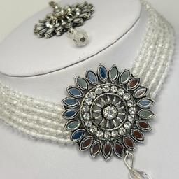 White pearl and silver mirror work choker necklace earrings and tika set.
