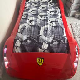 F1 racing single bed without mattress.
Fantastic looking, solid frame bed prefect for any car enthusiast. 4 sound settings activated by key fob: Knight Rider Theme, (with moving red at bottom light like KITT) Engine Start up/revving, & Central locking sound. Lights flash in unison with sounds. 2 tinted side windows can be added to the car to stop small children falling out of the bed.

Bought the bed from new & still have the receipt, selling as my son is now a teenager & would like a double bed.

There are a few scratches on the drivers side door, which is reflected in the price. Other than the scratches the bed is in good condition.

Age range recommendation 3yrs - 15yrs

£250 - Open to sensible offers.

Collection only