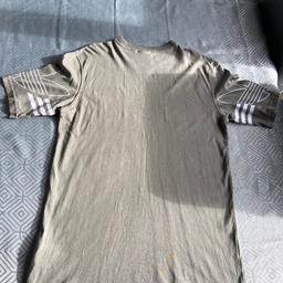 I have a green adidas T-shirt in a size xs with the adidas logo on both sleeves and a small stitched logo on front of T-shirt the T-shirt is in used good clean condition and it is cash on collection only you are more than welcome to come and view before purchasing thanks