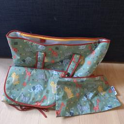 Animal print with giraffes, hippos,
Sage green with orange trim and print
1 carry bag with pocket inside
1 toiletry bag with zip and clip
1 fold up chage mat
Hardly used
