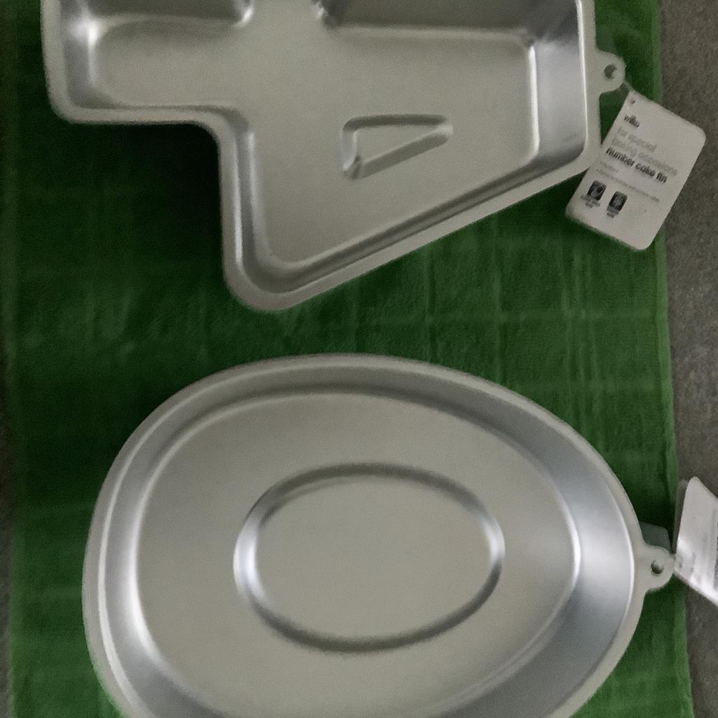 Two cake tins, numbers 4 and 0, £3 each.