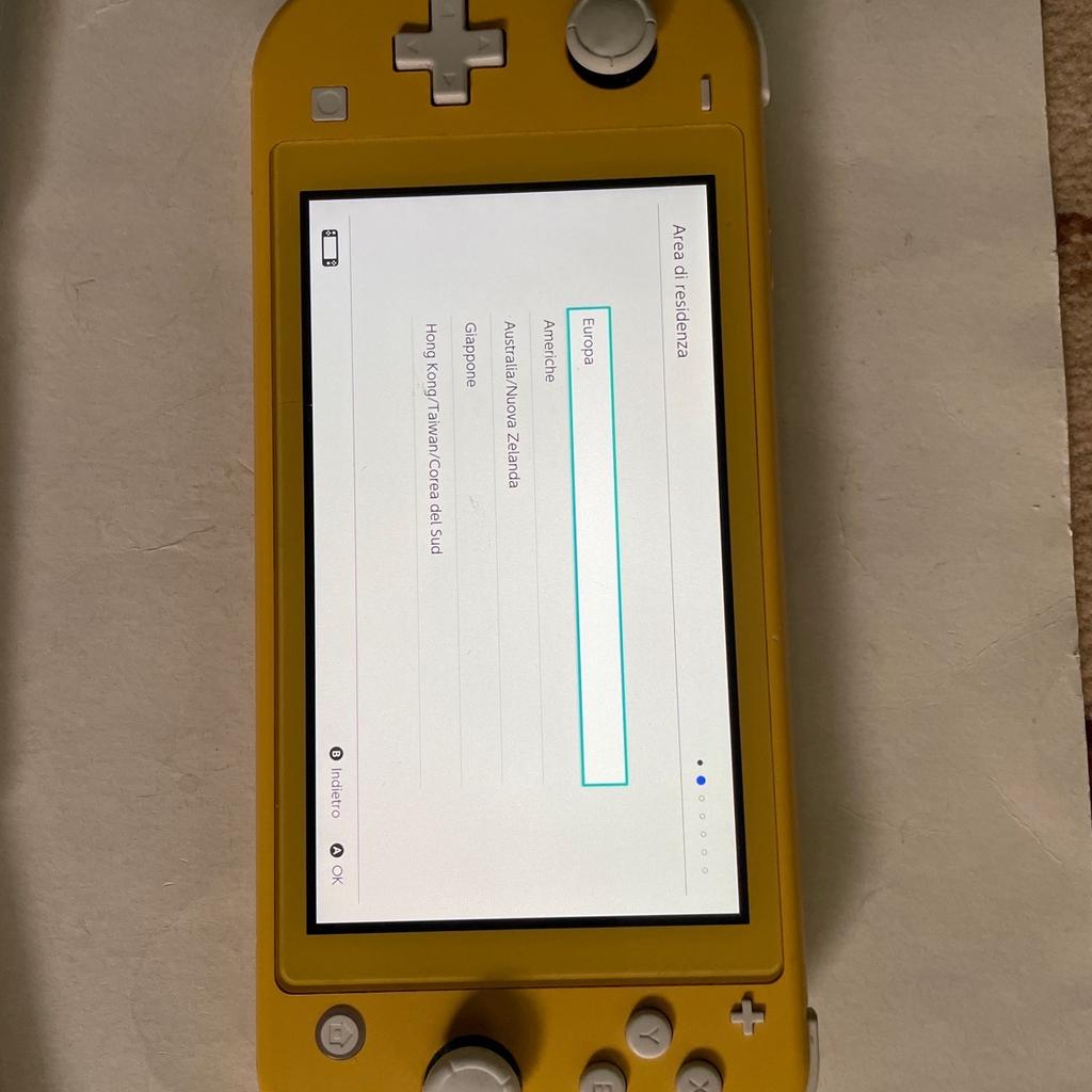 Yellow Nintendo Switch Lite Console in good condition just a few very light marks on screen not noticeable when console is being operated,comes with Four games consisting of unopened GhostBusters the video game remastered/Unopened Who Wants To Be A Millionaire/and Two films on one cartridge ie Aladdin and Lion King no booklet,also comes with replacement charger