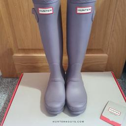 Hunter Wellington boots. 
Matt light purple/lilac "thunder cloud" edition. 
Worn once in the snow, as good as new.
They've had a thorough clean. (Photos now updated)
All original packaging, tags and box included. 
Size 3 - Will likely fit a size above or below depending on your socks. I'm a 3-4.
Great birthday or Christmas present. 