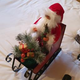 Santa on a sleigh. approx 16 inch tall and 14 inch long as new condition pick up s645ut kilnhurst or could deliver local for fuel cost