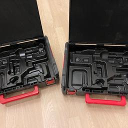 Two Milwaukee impact wrench cases with detachable inlays
