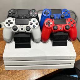 Disc verison. With 4 original PS4 controllers (blue, white, red, black) with 2 charging stations.

Boxed with 15 games as listed on photo (please see image 3).

All in good working order. Have upgraded to PS5 therefore have little use for it.

No time wasters. Cash on collection. No delivery. No silly offers!!!

Games included:

1. Uncharted 2 Among thieves remastered
2. Call of duty black ops
3. Fall out 4
4. Doom
5. FIFA 18
6. The last of us remastered
7. Grand theft auto 5
8. Injustice 2
9. Ashes Cricket
10. Destiny The taken king Legendary Edition
11. Destiny 2
12. Hustle Kings VR
13. Limited edition Formula 1 2016
14. Minecraft
15. Madden 17