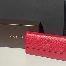 A spacious leather wallet by Gucci, great to convert into a mini bag by adding a strap as demonstrated; chain strap not included. Can comfortably fit mobile, several cards, notes etc.

Size is 19cm length and 10cm in height.

Condition is good with some darkening sports in areas, mainly noticeable at the front Gucci inscription. Internally it’s in very good condition.

Please note, chain strap is only for demonstration purposes and not included in the sale.

The large wallet comes with the original box displayed in the picture.