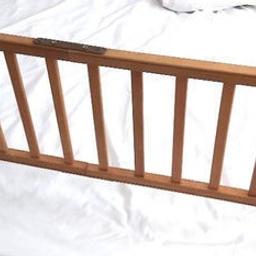Tomy Snugli Guard Rail.

A brand you can trust.

Super high-quality folding cot bed guard is made of solid pine wood and is completely safe for your baby.

Solid Wood Bed Rail For Toddlers Cot Bed Guard Bed Rails
Suitable for children aged 18+ months.

Feet slips under the mattress to hold the barrier in place.
Folding feet for storage or hung up.

Local collection preferred or can be posted out at extra costs.  Please if posting, this will be sent separated, as easily detached with screws.