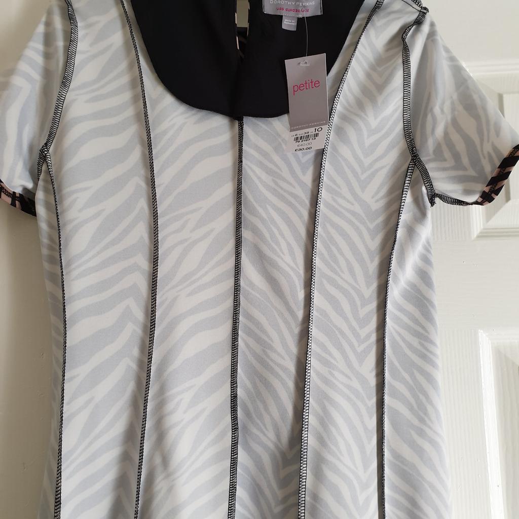 Dress " Dorothy Perkins " Petite

 With Pockets

Beige Black Colour

New With Tags

Actual size: cm

Length: 89 cm

Length: 64 cm from armpit side

Shoulder width: 34 cm

Length sleeves: 18 cm

Volume hands: 40 cm

Volume breast: 80 cm – 92 cm

Volume waist: 76 cm – 84 cm

Volume hips: 84 cm – 88 cm

Size: 10 (UK) Eur 38 ,US 6

Main: 97 % Polyester
 3 % Elastane

Lining: 100 % Polyester

Made in Romania

Retail Price £ 30.00, 40.00 € (Eur)