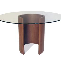 Tom Schneider round dinning table with four chairs. In excellent condition. Please let me know of any questions.