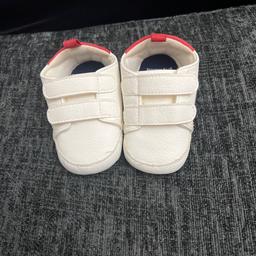 Next white trainers 
Really cute 
Hardly worn 
Size 6-12 months or eu 18