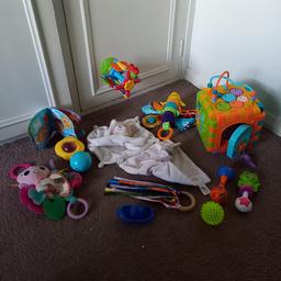 mixed bag of items all in good condition 
bath suction toy with spinning effect and toy boat
play cube with different play on each side. Key attached to open door on cube
soft baby blanket toys
rattle toys