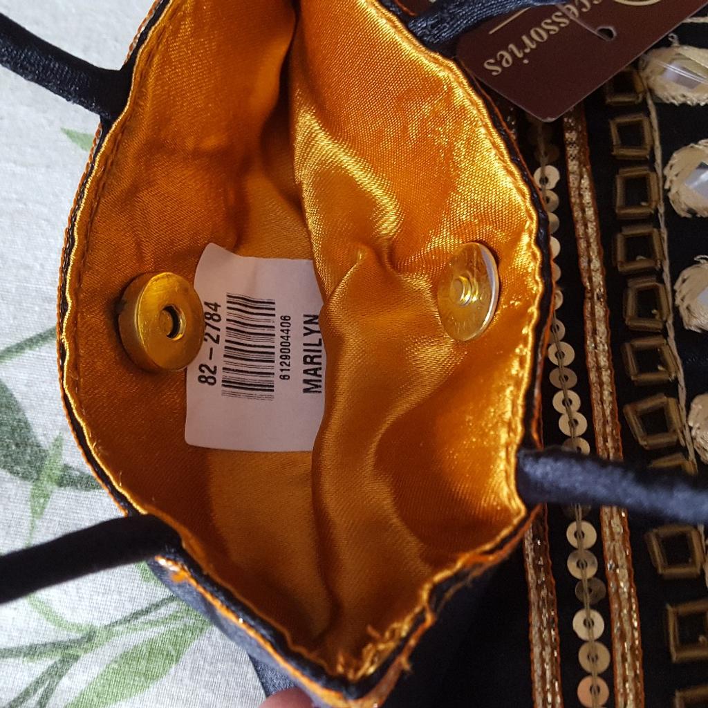 Stunning brand new with tags small satin evening bag with beading and mirror sequins. This has the most gorgeous eye-catching gold satin lining and closes with a magnetic gold clasp. Purchased from Accessorize and just had it in a drawer. Happy to post