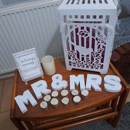 Wedding day items; MR & MRS, 9 wooden table number holders, "In loving memory" easel & candle, white card "money & cards" cage with ribbons. As photos, slight tear on one corner of cage (easily fixed)