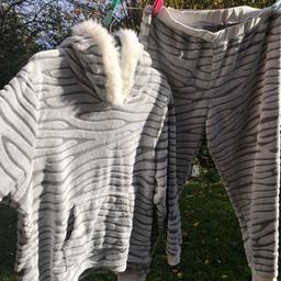 Gorgeous new cosy pyjamas . New still with label attached we’re £22. Grey fleecy material super soft with cosy fluffy hood and pocket to the front. Lovely set as a gift too