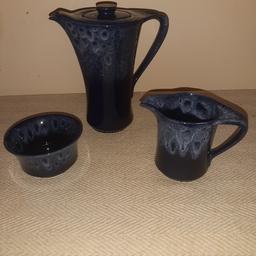 vintage kernewek pottery blue honeycomb design.made in goonhavern Cornwall.
tea/coffee pot.
sugar bowl.
milk/cream jug.
all in mint condition never used.