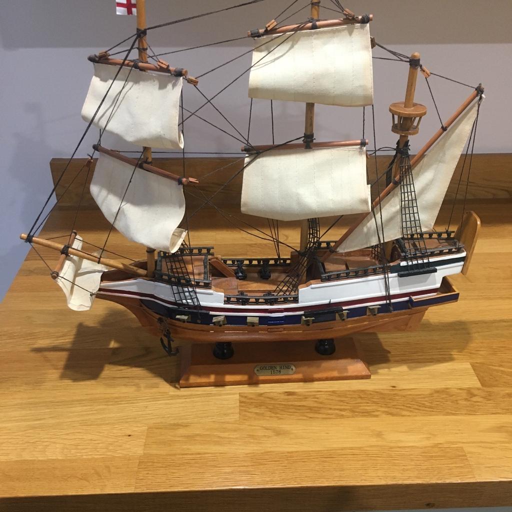 Unwanted raffle prize. Wooden model of Golden Hind ship. On a plinth so is free standing. Surface dust but otherwise perfect condition