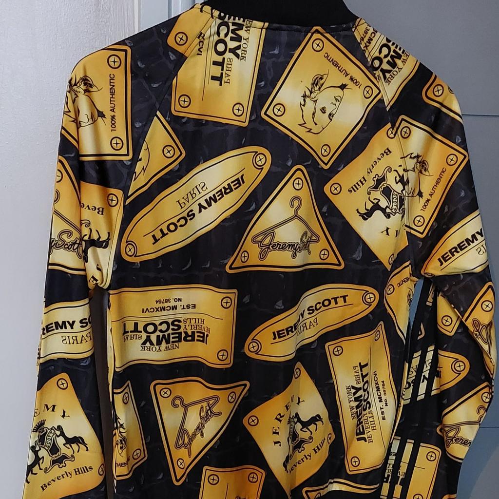 Adidas x Jeremy Scott Plaque Tracktop

Brand new with tags

Never been worn

100% Authentic & Genuine

Size: Small

Colour: Black & Gold

Full zip closure and 2 front zip pockets

All over Jeremy Scott Plaque design in Gold

Ribbed Neck, Cuffs & Hem

Deadstock - sold out everywhere and impossible to find in this condition.

This tracktop design was worn in the Kingsman movie.

Only genuine buyers please and no derogatory offers!!!!

No returns accepted!!!!

COLLECTION & CASH ONLY!!!!