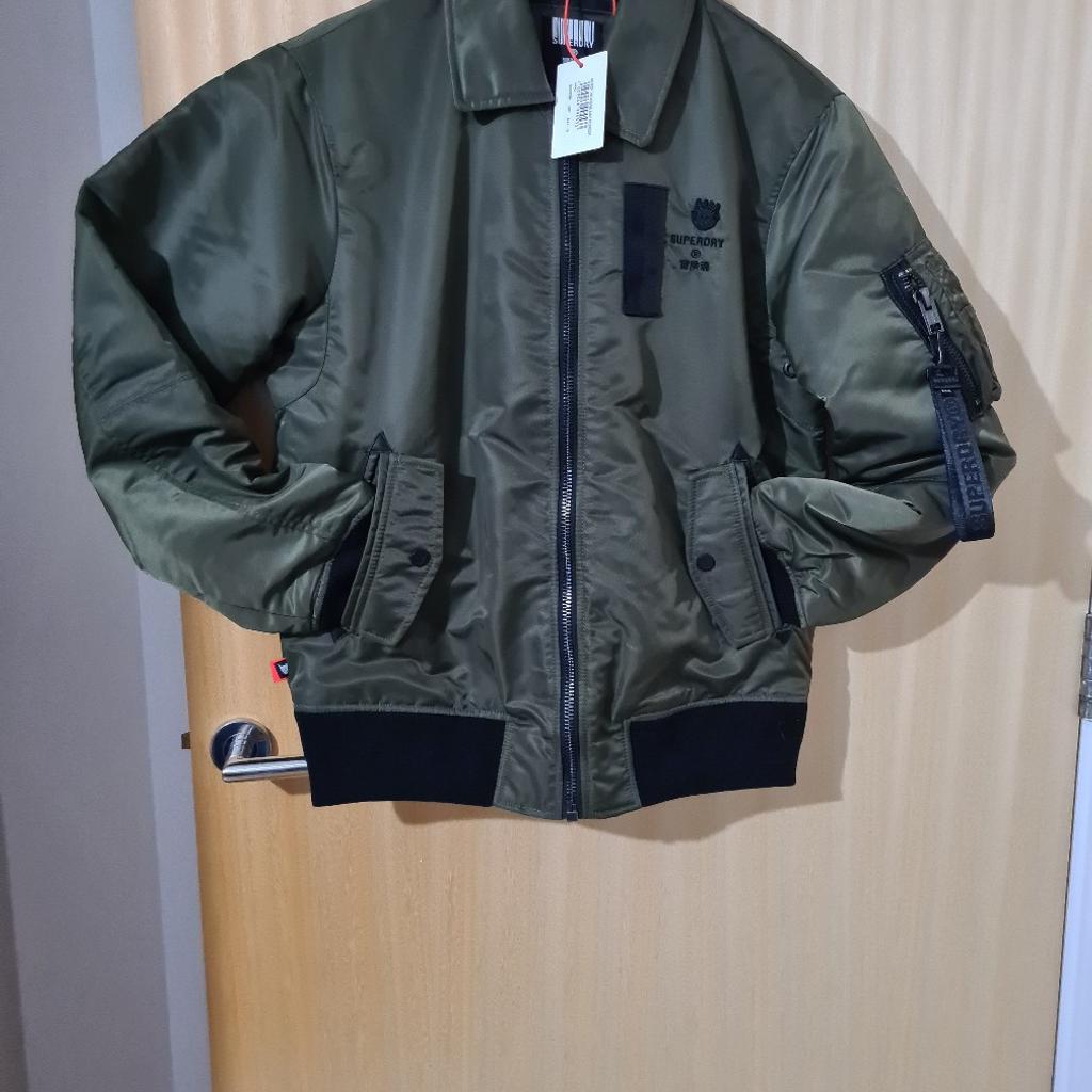original Superdry bomber jacket. dark green colour. size 10uk. very stylish, lightweight, and comfortable. all the tags and labels present. The original price was £109. Any questions please sens a message.