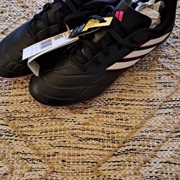 Brand new, tags still attached and in original box, cost £35. Adidas Copa Pure football boots, black with white stripes and a pink trim. Soft synthetic leather. Too small for my daughter so might actually fit a size 5 better. Can try on before you buy, collection only from Woodfield Plantation Balby, Doncaster.