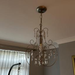 Beautiful and antique effect chrome chandelier light fitting. Hanging design with removable crystal droplets. Chain wire fixing at the top.  Single teardrop  LED bulb included. Used but still in great Condition. Unique design. Priced cheap to sell. Retail well over £50