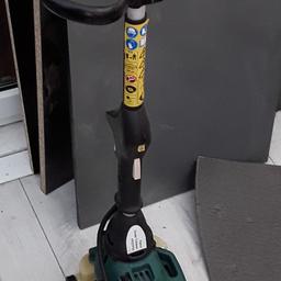 Generic petrol strimmer used but in good condition.
