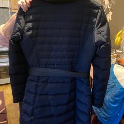 Lovely warm padded stylish women’s zara 3/4 length winter coat with front full zip and side bottom zips also popper buttons with belt and 2 zip side pockets and material design sides and fur trim around the collar. Size small Pick up only.