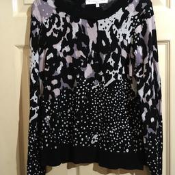 Ladies Black jumper from Next.  Leopard print and polka dot print. Size 8. True to size. Crew neck.